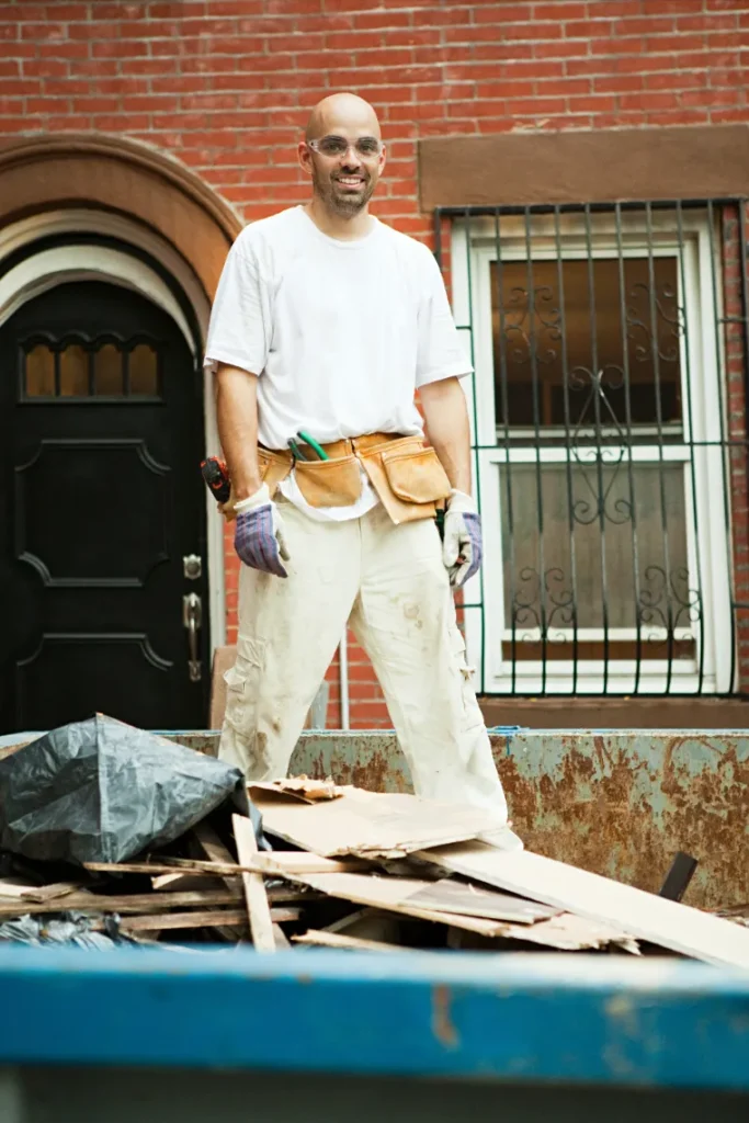 Man performing construction debris removal for faster project flow.